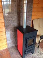 Купить стальной камин Везувий ПК-01 (270) в Минске фото в интерьере в Минске