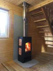 Популярный камин с дровницей Сибирь 8 в интерьере фото в Минске