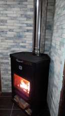 Стальной недорогой камин Теплодар ОВ-120 (угловой) фото в интерьере в Минске