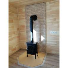 Чугунный камин со стеклом Сибирь 7 фото в интерьере в Минске