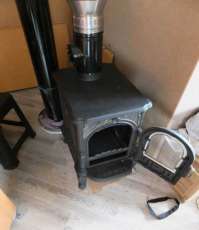 Недорогой печь-камин со стеклом Сибирь 6 фото в интерьере в Минске