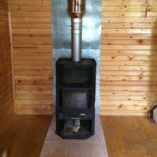 Печь-камин с шамотом Мета-Бел Ангара-Аква в интерьере фото в Минске