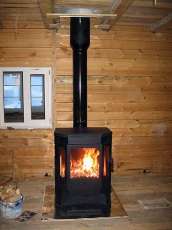 Печь-камин Бавария водяной с плитой в интерьере в Минске