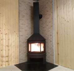 Стальной камин Бавария Мюнхен угловой чёрный (без перемычки) фото в интерьере в Минске