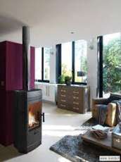 Печь-камин чугунный Invicta Gomont в интерьере Амазонка бай фото в Минске