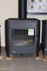 Печь-камин чугунный Invicta Carolo в интерьере Амазонка бай фото  в Минске