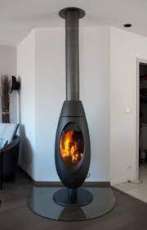 Печь-камин чугунный Invicta Ove в интерьере Амазонка бай фото в Минске