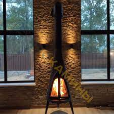 Печь-камин чугунный Invicta Pow-Wow в интерьере Амазонка бай фото в Минске