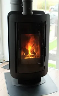 Печь-камин DEFRO HOME OVAL в интерьере Амазонка бай фото в Минске