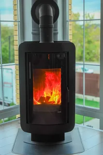 Печь-камин DEFRO HOME OVAL в интерьере Амазонка бай фото в Минске